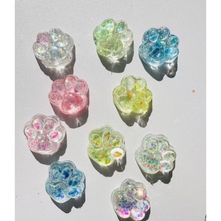 Jucarie Antistres Squishy, Cyrax, cu Revenire Lenta, Squeeze Pinch Family, Model Cat Paw, 6.5 x 7 cm, din Tpr, 4-6 Ani, Model 4 Sclipici, Transparent