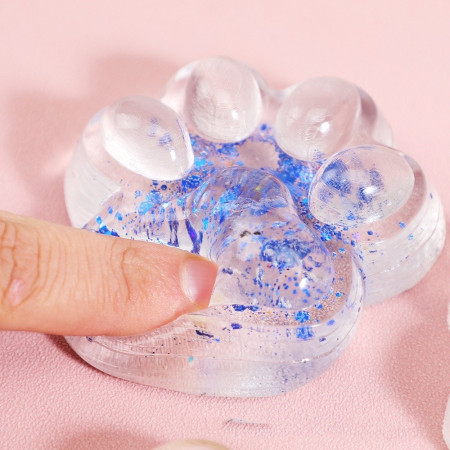 Jucarie Antistres Squishy, Cyrax, cu Revenire Lenta, Squeeze Pinch Family, Model Cat Paw, 6.5 x 7 cm, din Tpr, 4-6 Ani, Model 4 Sclipici, Transparent