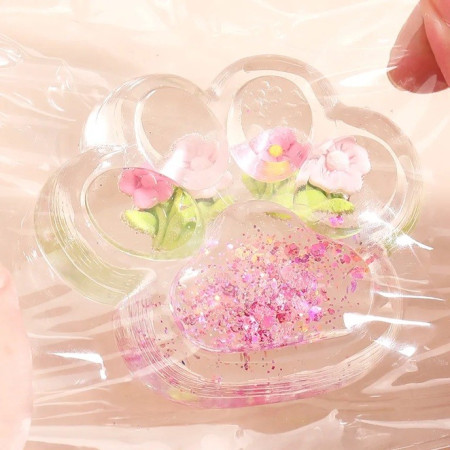 Jucarie Antistres Squishy, Cyrax, Labuta de Pisica Pufoasa, cu Revenire Lenta, 7 x 6.5 cm, Model Flori 1, Transparent