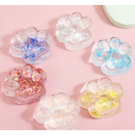 Jucarie Antistres Squishy, Cyrax, cu Revenire Lenta, Squeeze Pinch Family, Model Cat Paw, 6.5 x 7 cm, din Tpr, 4-6 Ani, Model 4 Sclipici, Transparent