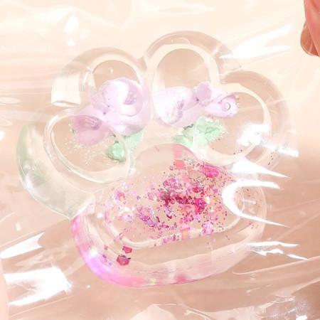 Jucarie Antistres Squishy, Cyrax, Labuta de Pisica Pufoasa, cu Revenire Lenta, 7 x 6.5 cm, Model Flori 1, Transparent