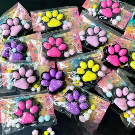 Jucarie Antistres Squishy, Cyrax, cu Revenire Lenta, Squeeze Pinch Family, Model Labuta de Pisica, 6.8x6.2 cm, 55g, Ambalaj Transparent, Mov